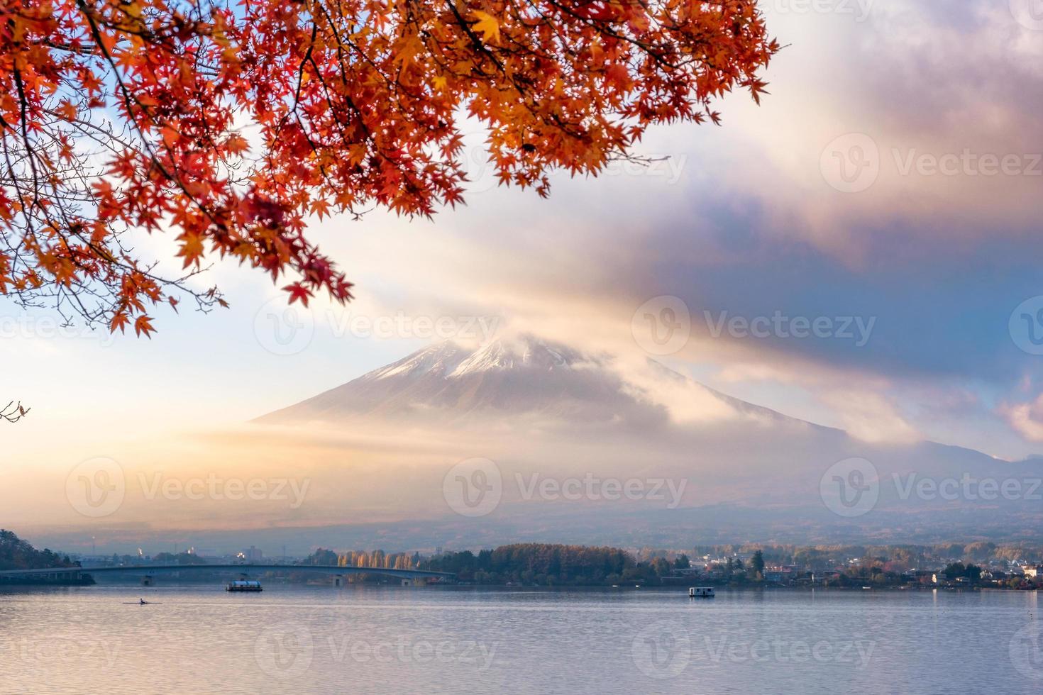 Mount Fuji through fog with red Maple cover in sunrise morning photo