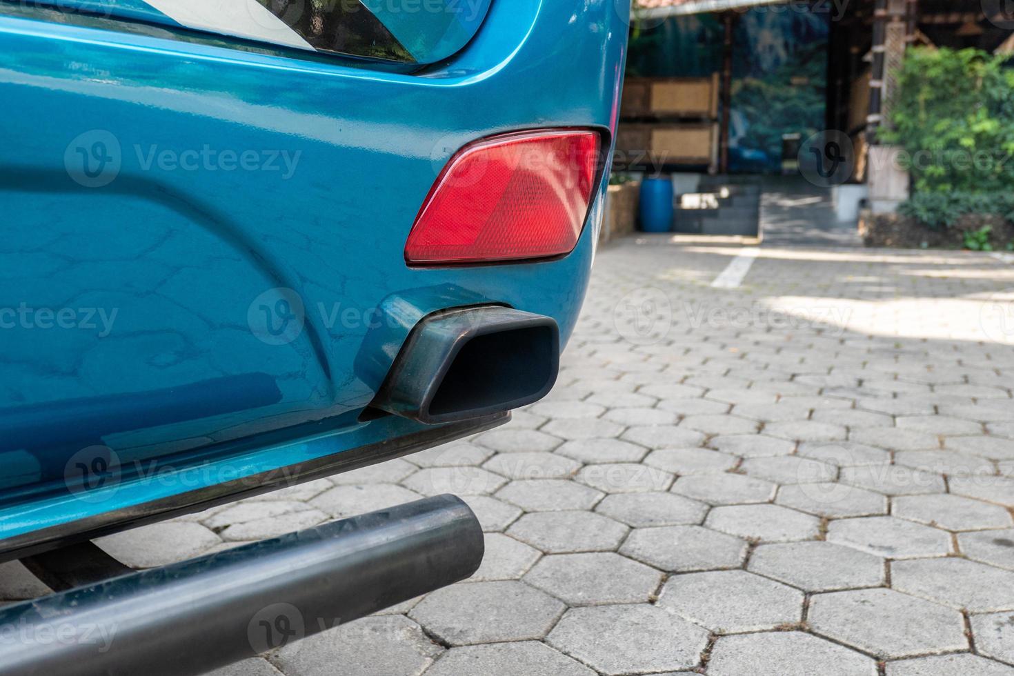 Rear bus intake pipe with red taillight photo