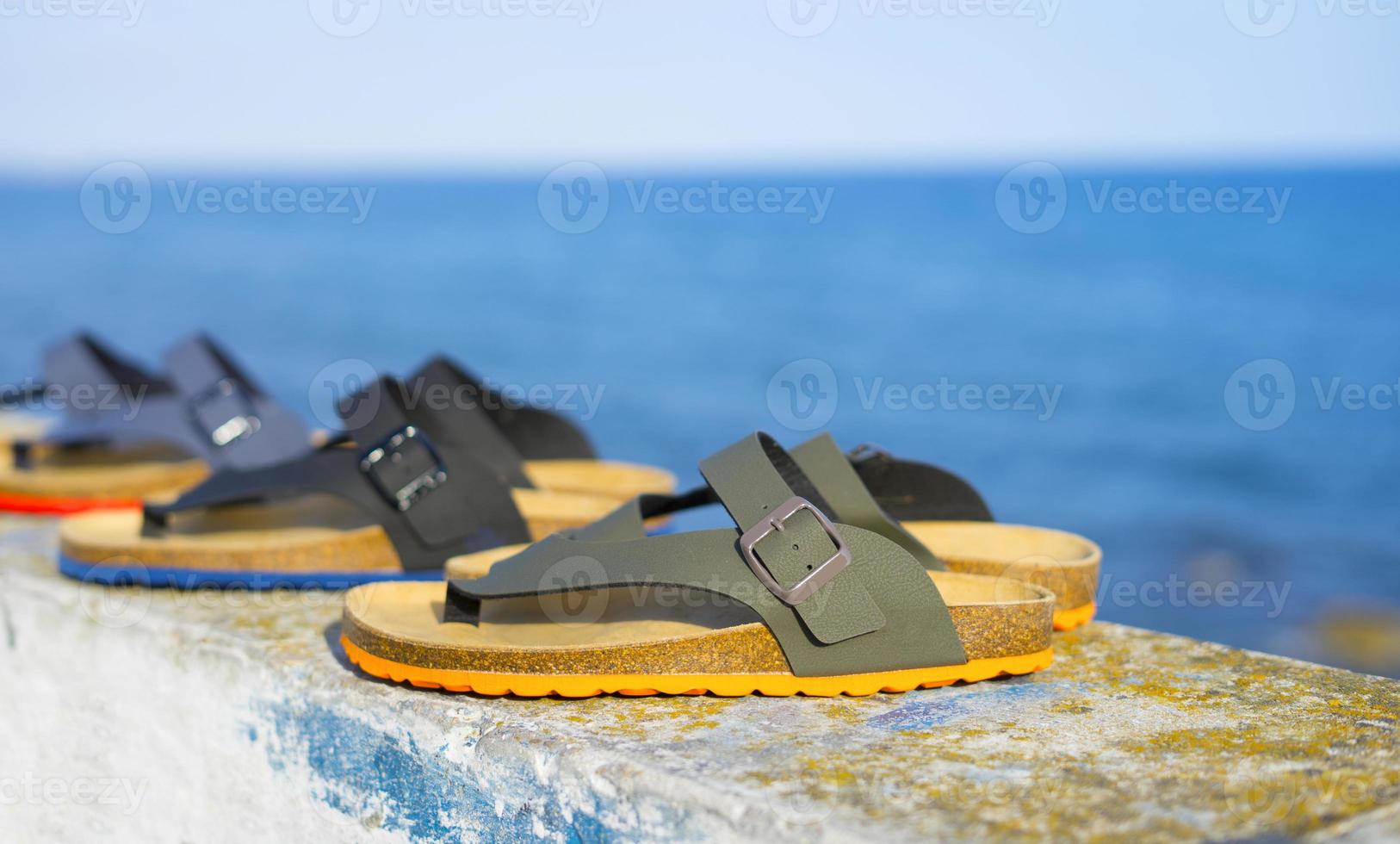 Modern men's sandals in different colors for summer holidays photo
