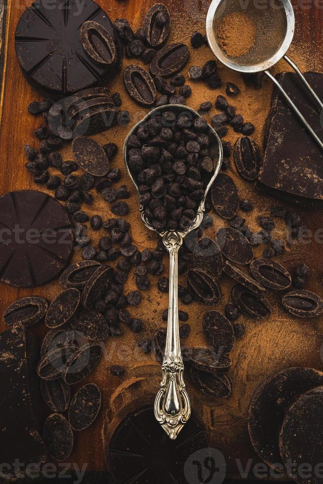 silver spoon full of dark chocolate chips photo