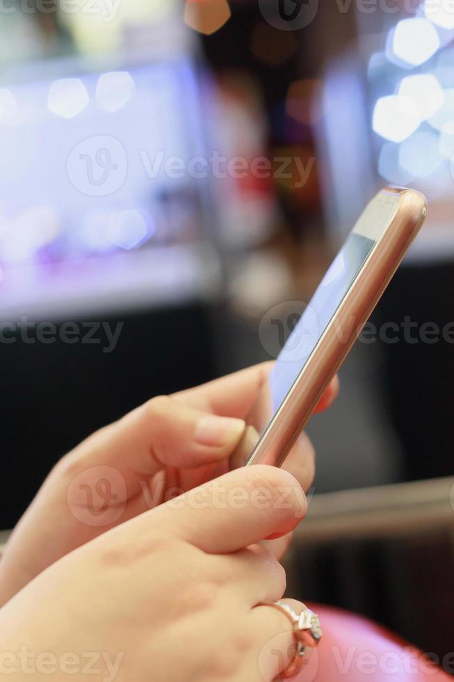 Woman using her Mobile Phone photo