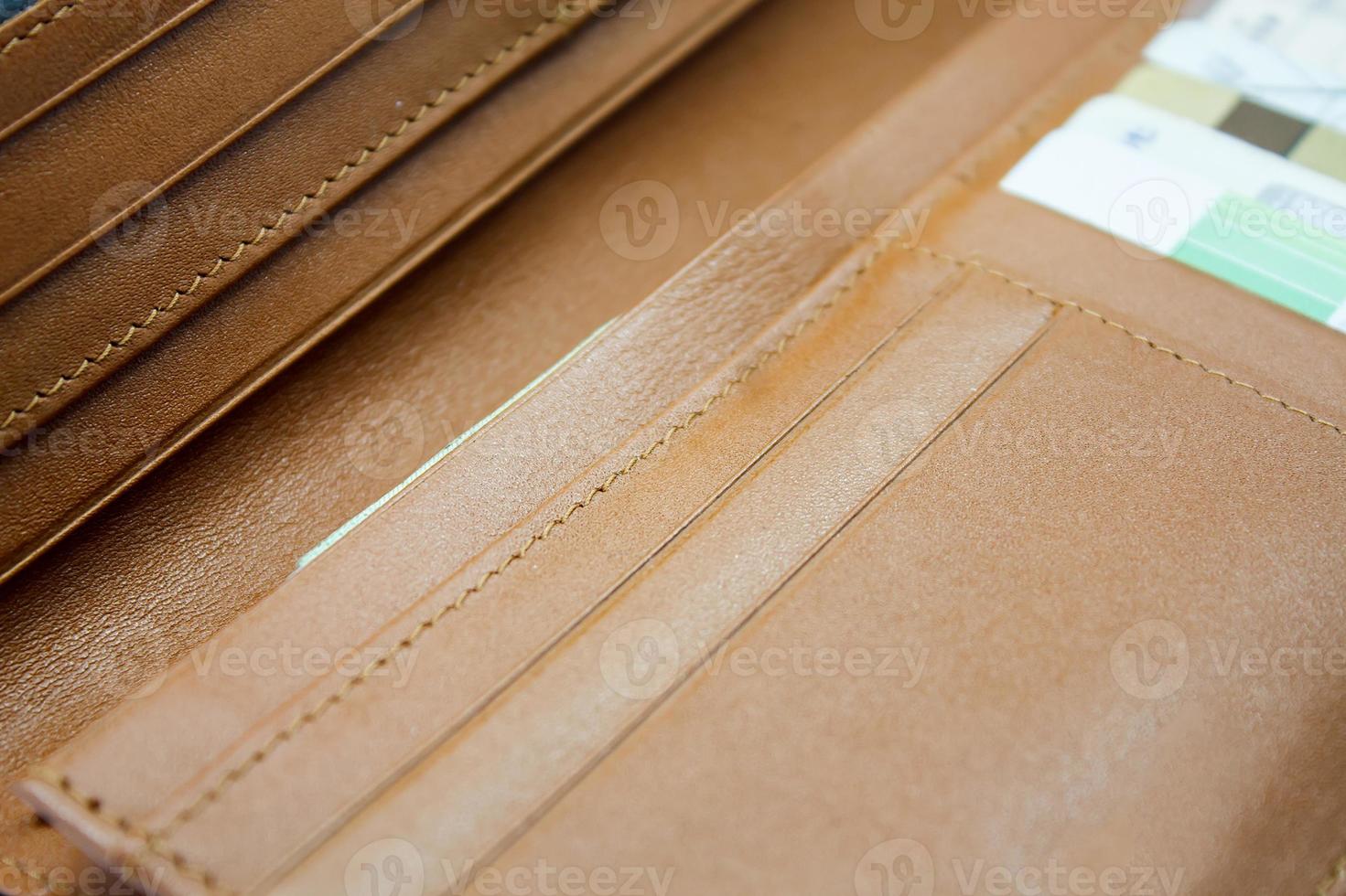 brown leather wallet with credit and discount cards photo