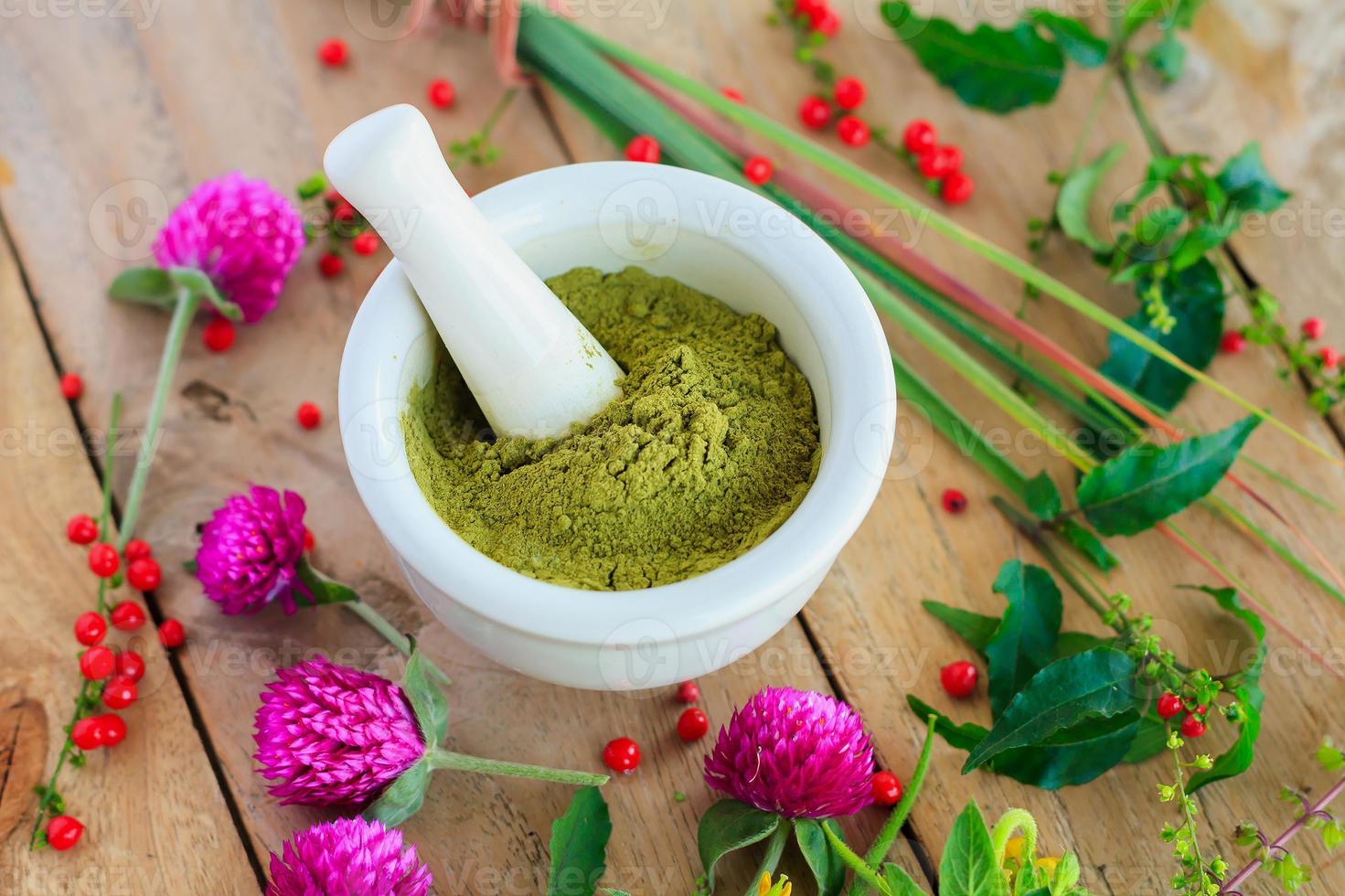 Fresh herbs powder in the mortar, alternative medicine photo