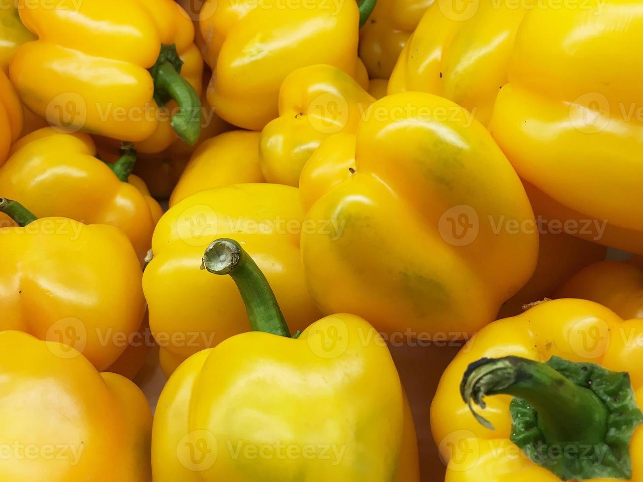 organic yellow bell peppers in market place photo