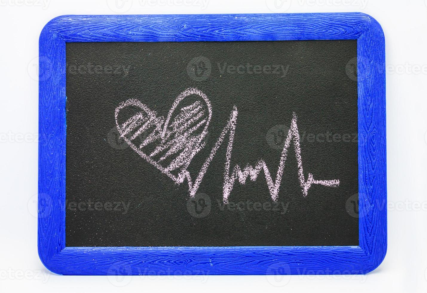 Heartbeat sign, love heart on a chalkboard photo