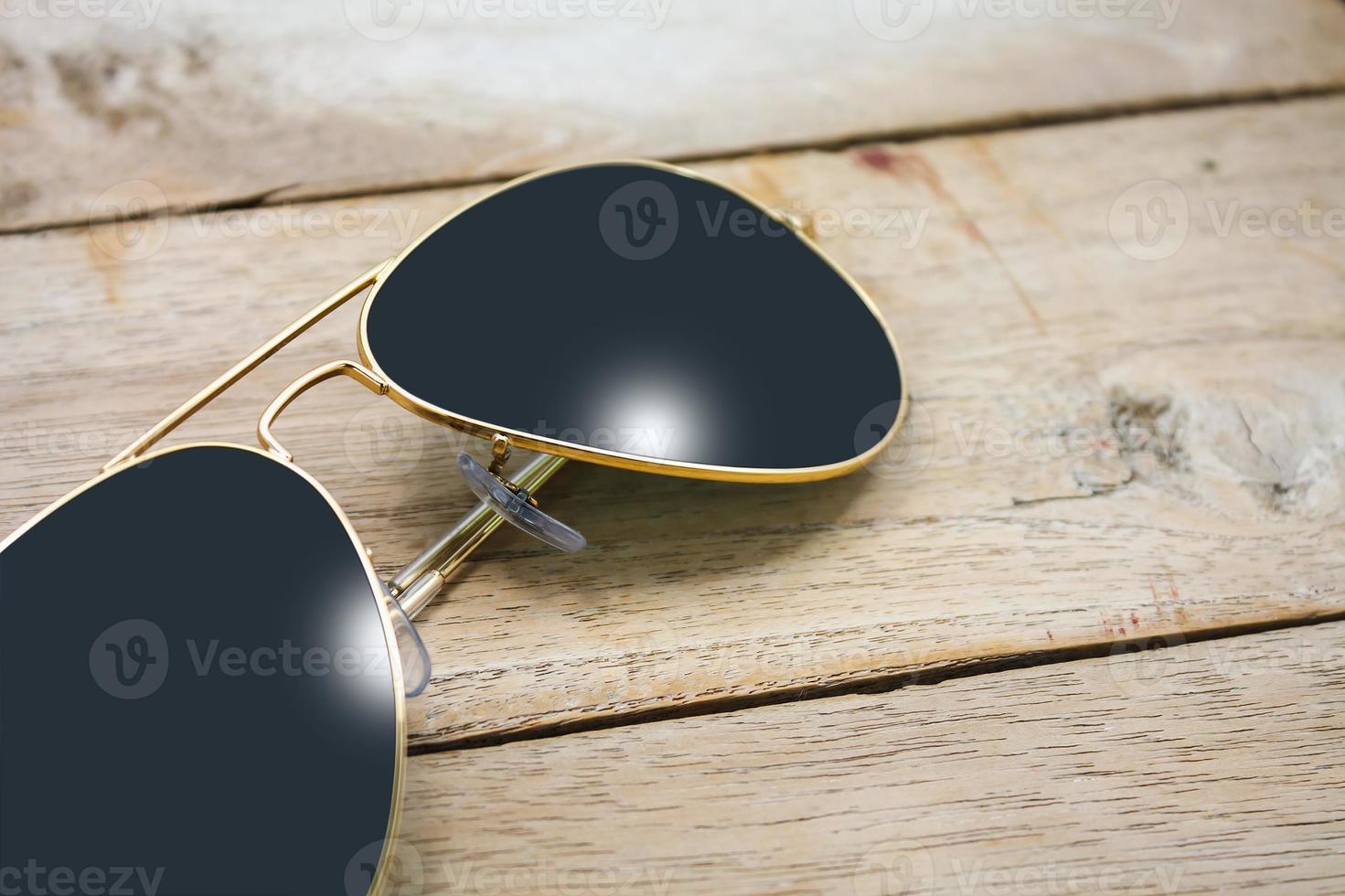 sun glasses on wood photo