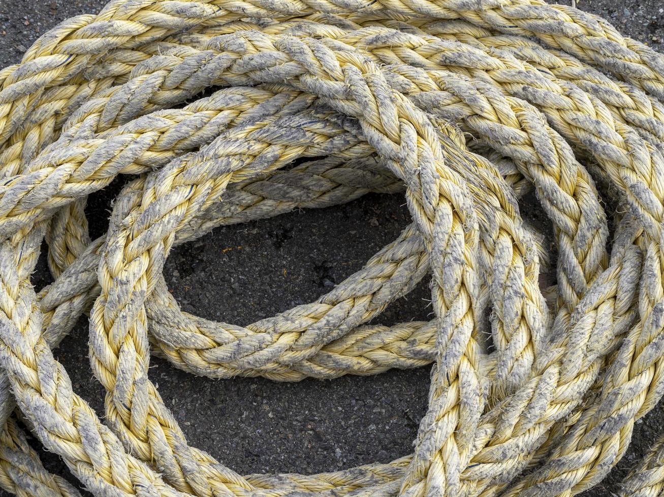 Closeup of fishing rope coiled on a quayside photo