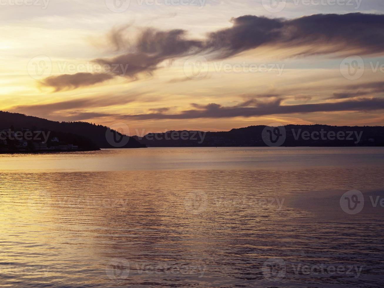 Sunset over a fjord near Voss, Norway photo