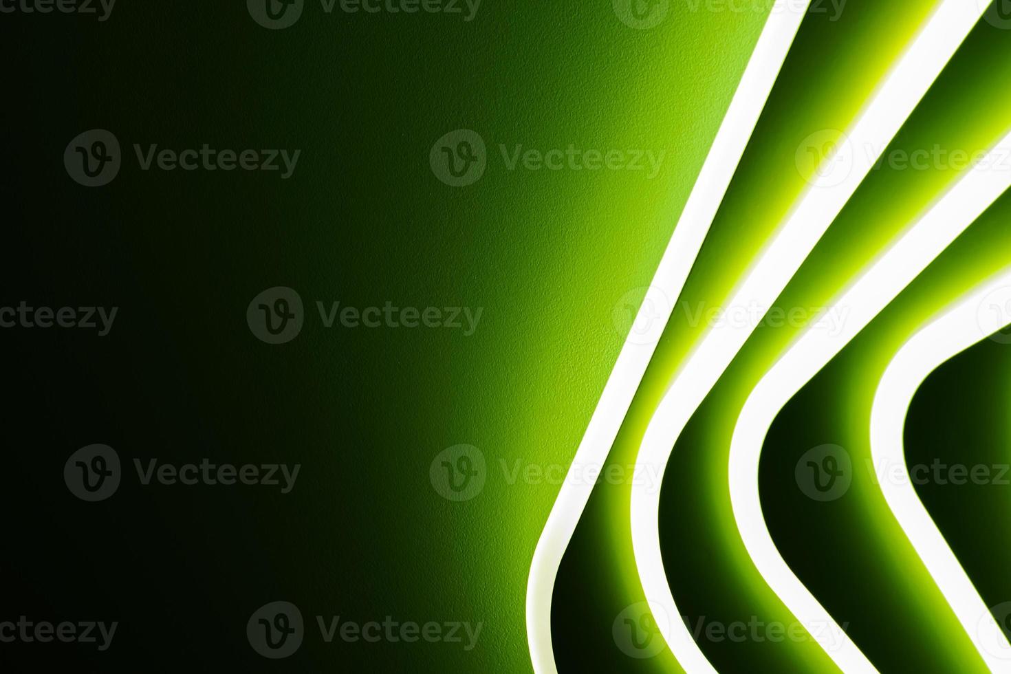 Abstract green light from a lamp on a black gray background. photo