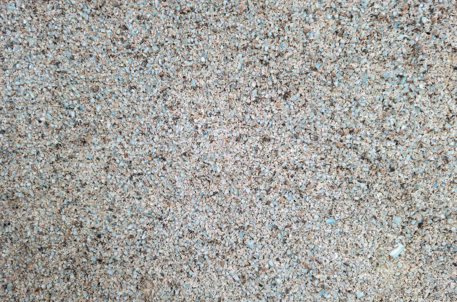 Background of small blue pebbles in a concrete solution. photo