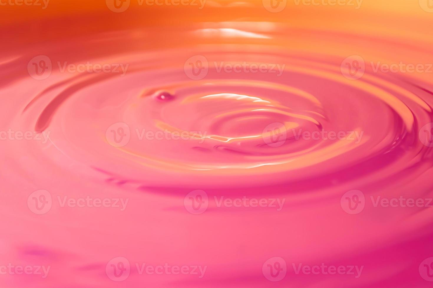 Pink strawberry cream illuminated with orange light. photo