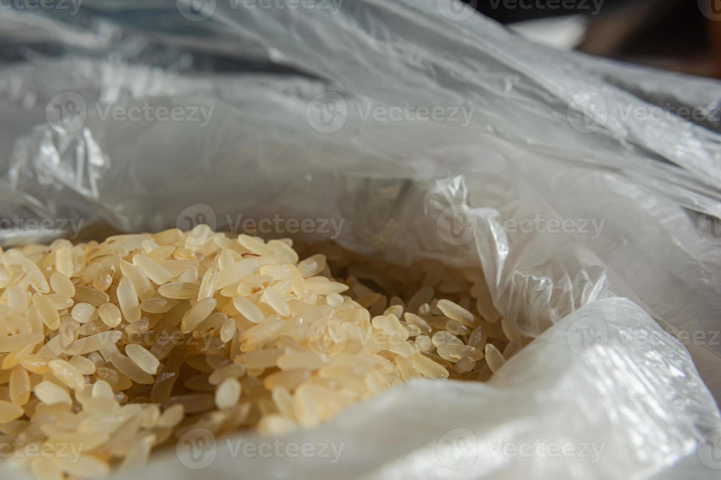 Dry rice in a plastic bag close-up. Culinary theme. Selective focus. photo