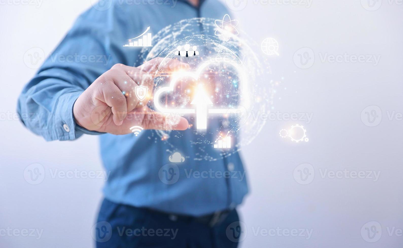 Businessman holding icon cloud computing with network and data information business. Protection database, business, internet digital network, technology concept. photo
