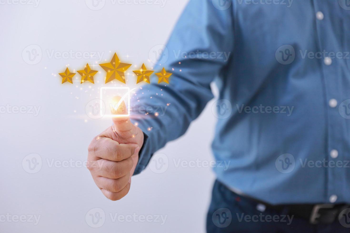 Businessman give rating to service experience on online application. Customer review feedback survey, satisfaction ranking high. Customer can evaluate of service leading to reputation ranking. photo