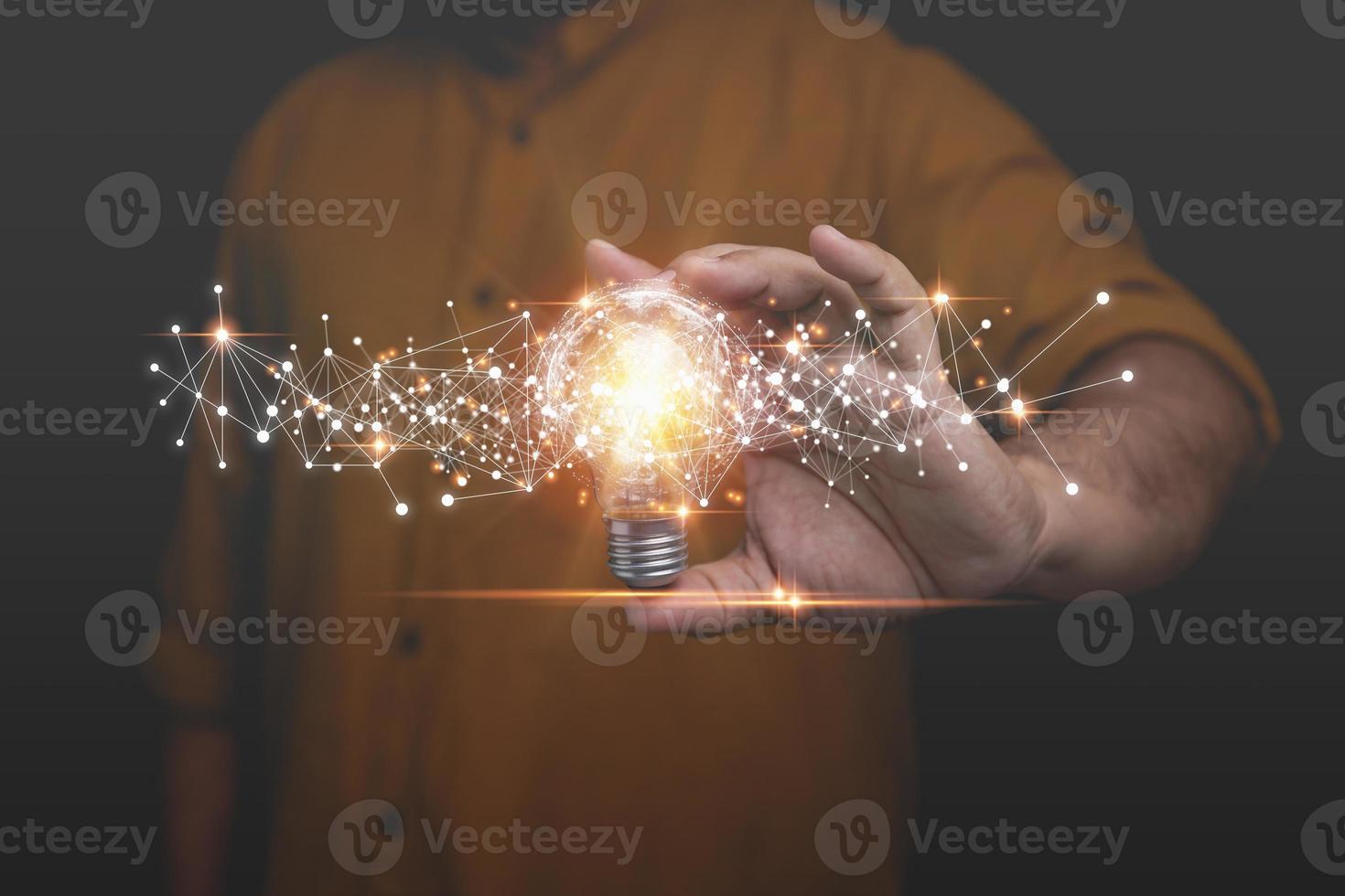 Businessman holding light bulb with network digital on hand. Creative new idea concept with innovation and inspiration, innovative technology in science and communication concept. photo