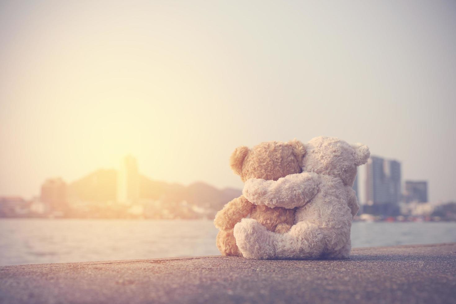 Love couple teddy bear show love by hugging each other. Picture old vintages style. Concept vintage, Valentines day, and love. Image warm tone. photo