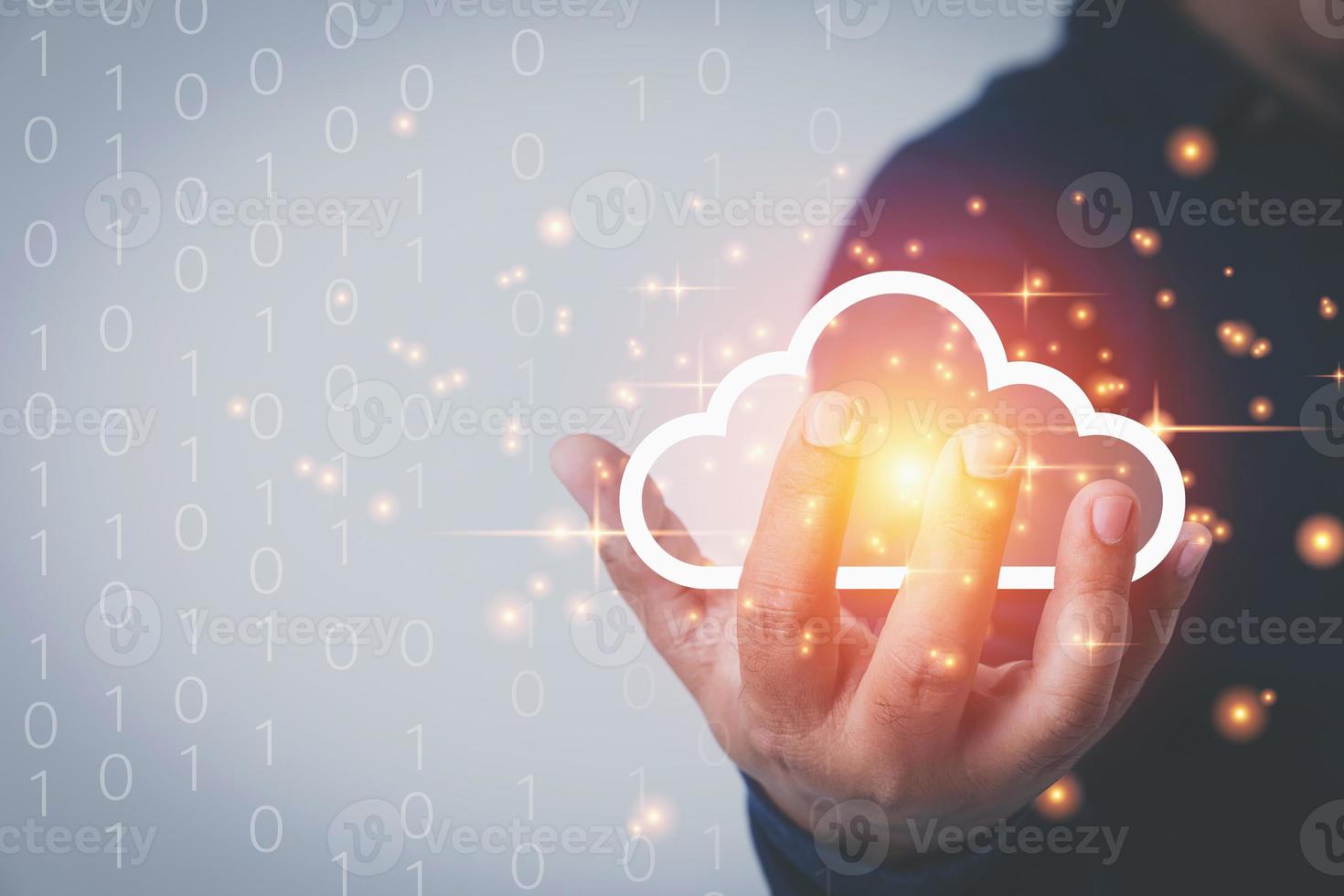 Businessman holding virtual clouds computing to transfer data information and upload or download database corporate with copy space. Technology transformation databases concept. photo