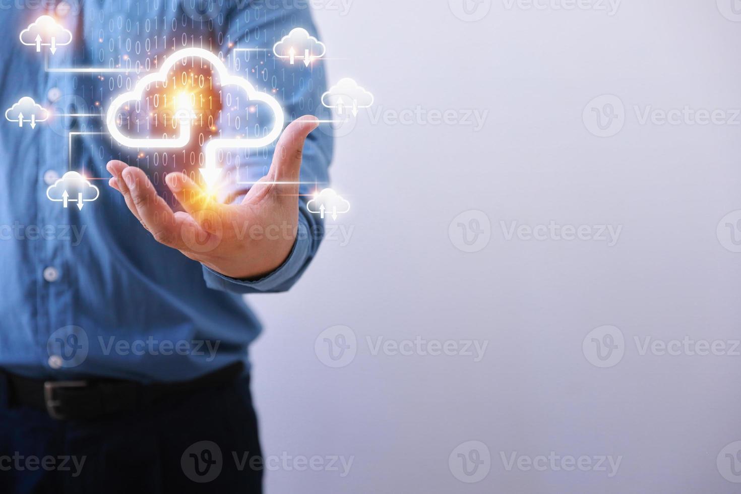 Technology business transformation concept. Businessman holding virtual cloud computing to transfer database. information upload, download application. photo