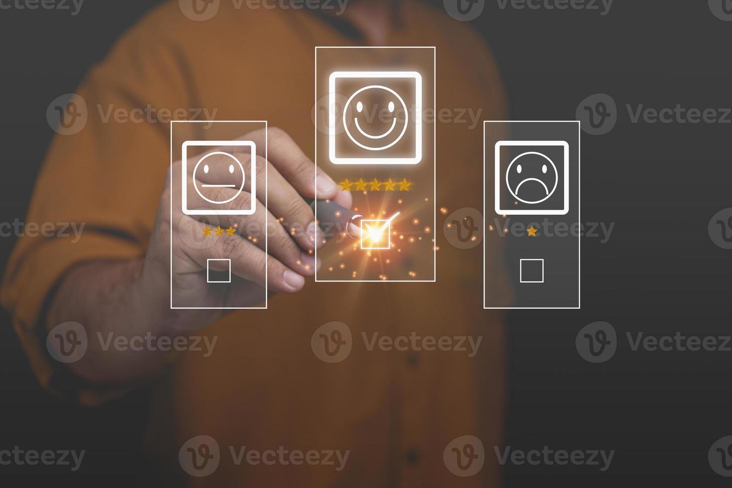 The businessman uses a pen to touch the virtual screen on the happy smiley face icon top 5 star with copy space. Satisfaction to service high, Customer service business concept, rating very impressed. photo