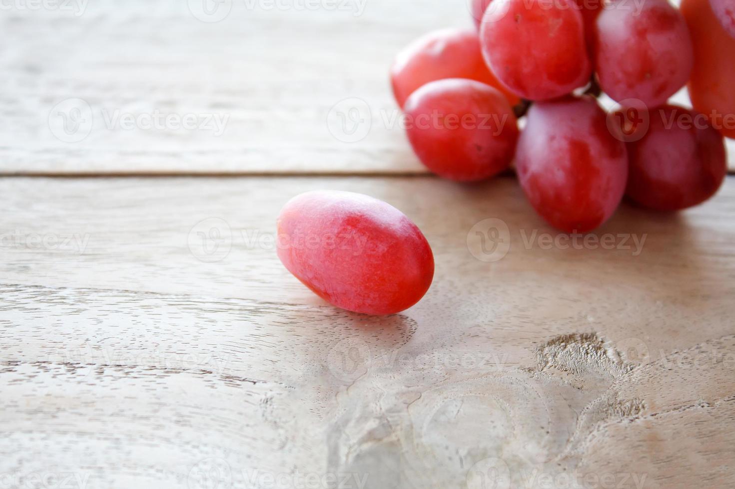 Grapes on a wooden table photo