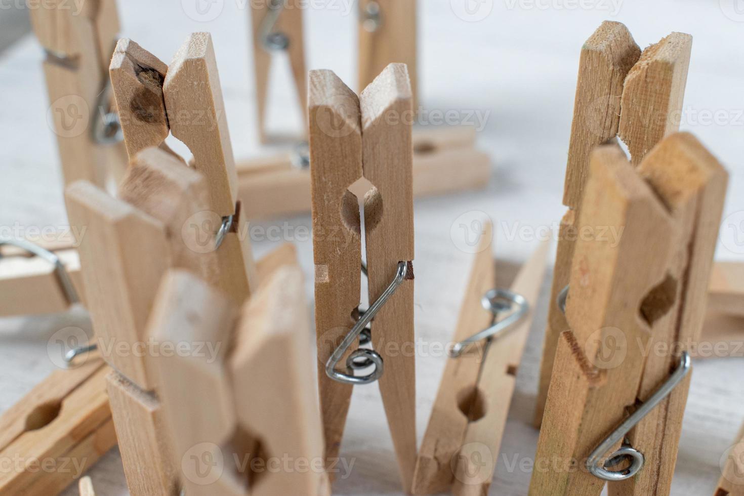 clothespins as concept people in a group with singled out figure photo