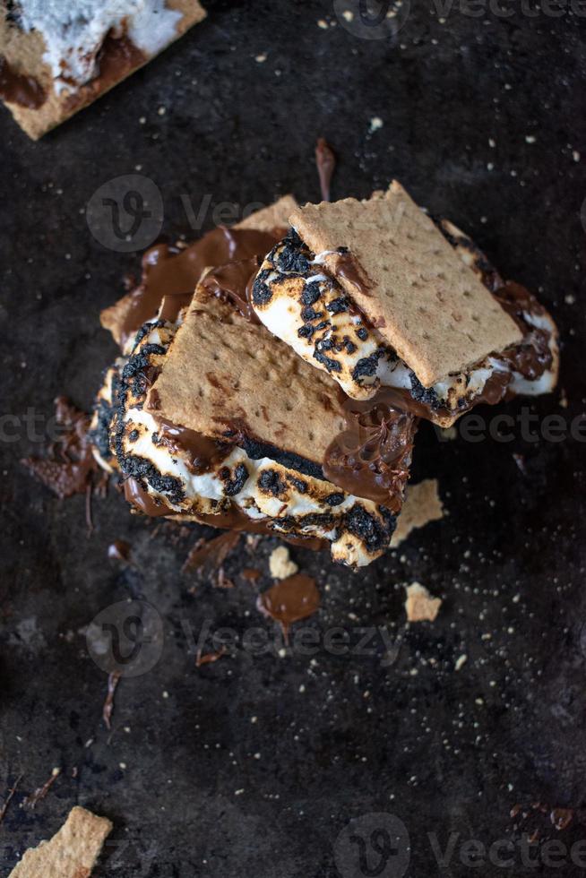 melted messy s'mores stack with toasted marshmallows photo