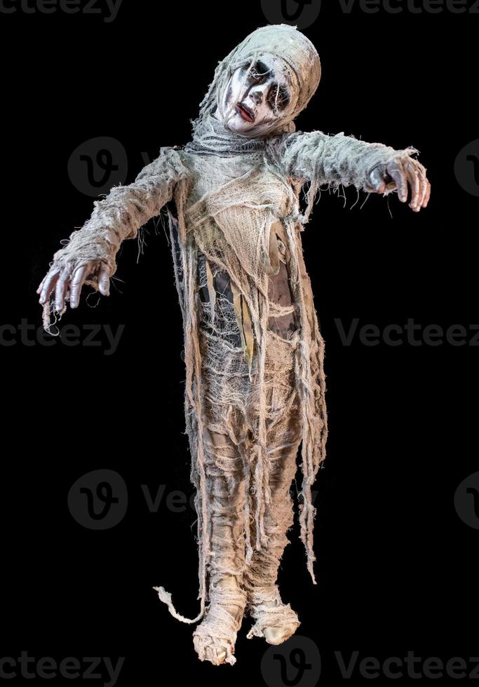 studio shot portrait of young boy in costume dressed as a Halloween, cosplay of scary mummy pose on isolated black background photo