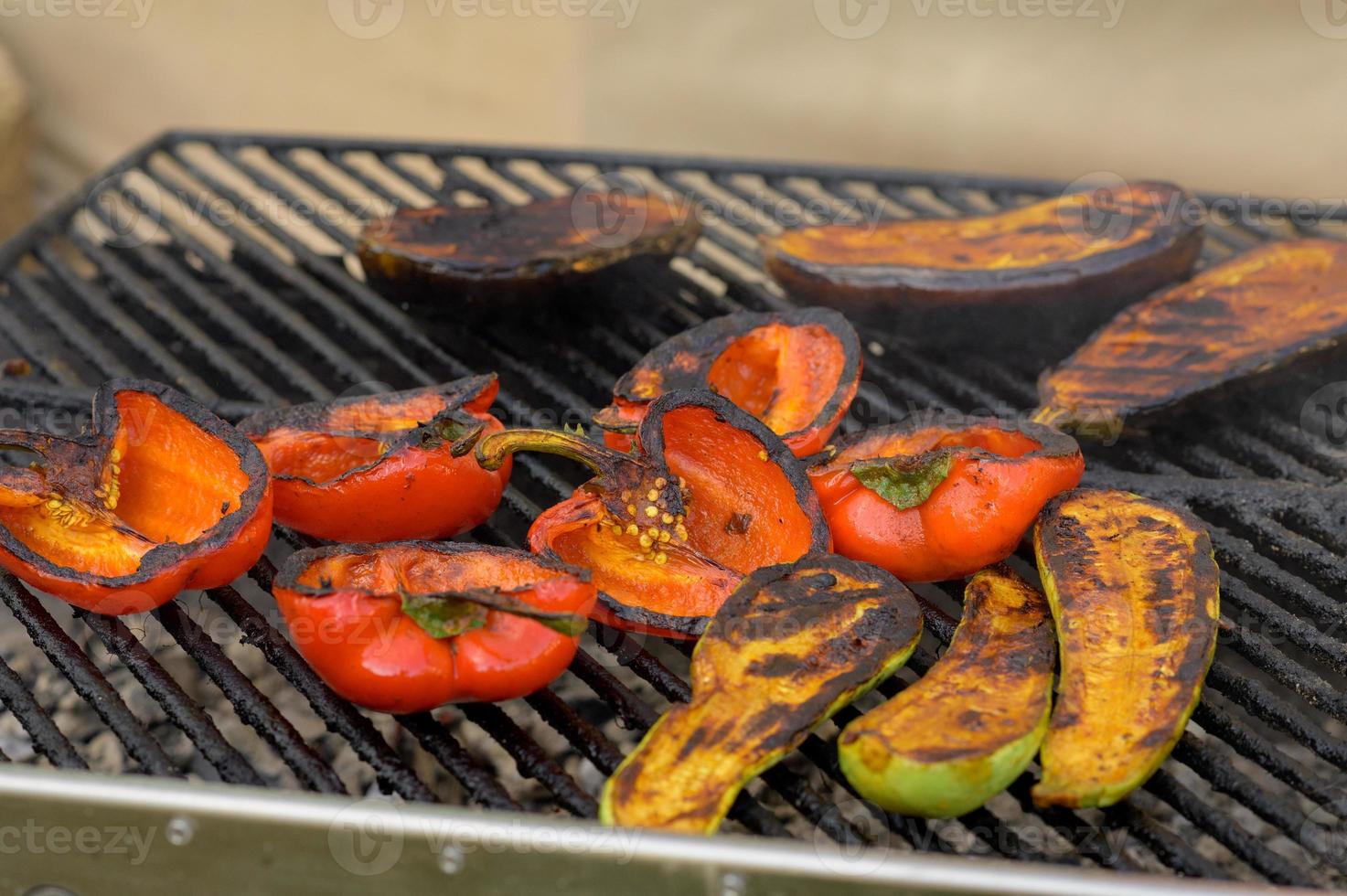 Grilled red and yellow peppers during a street food festival. photo