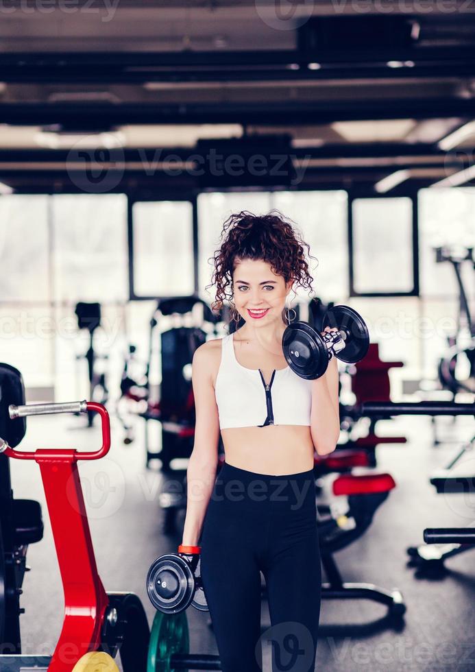 Sporty woman in gym photo