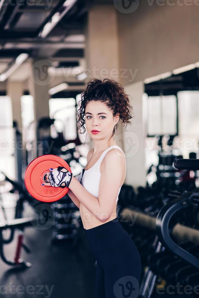 Young woman in gym photo