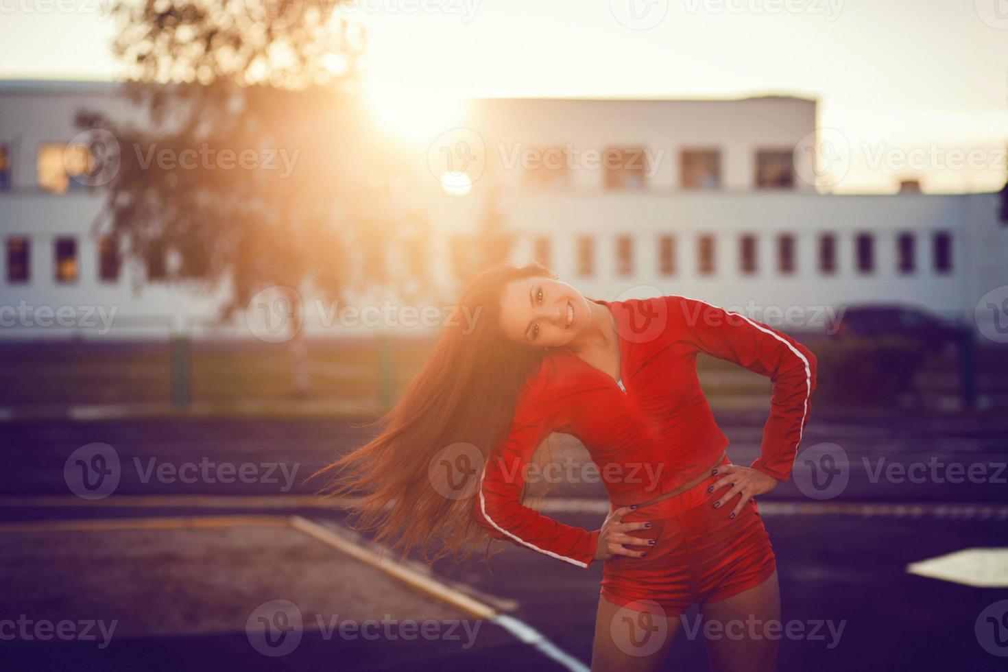 Happy successful sportswoman smiling photo