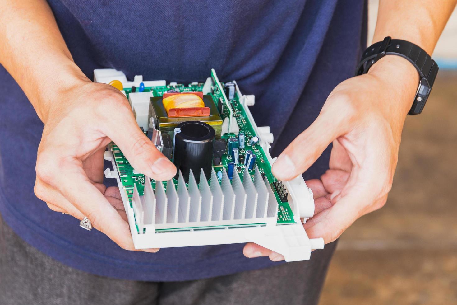 Technician holding computer electronic circuit board in the hand. photo