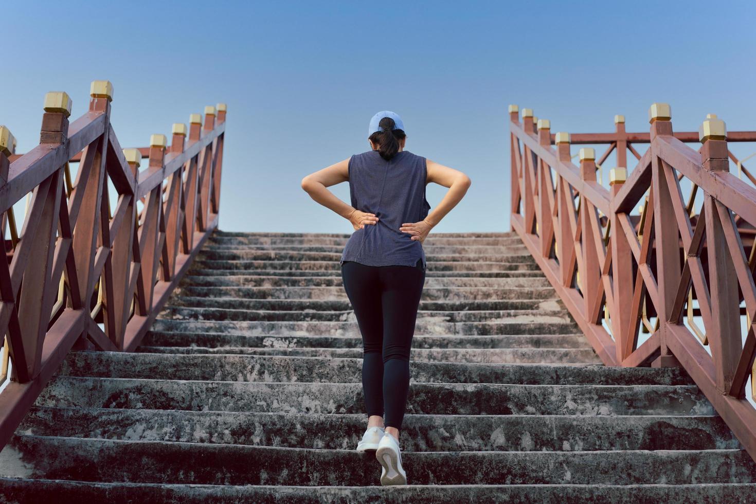 Woman exercise walking up the stairs burn fat, Healthy lifestyle concept. photo