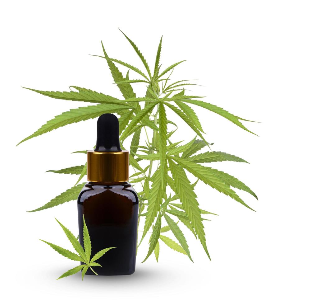 Cannabis essential oil container with hemp leaf is a natural herb used for medical purposes. photo