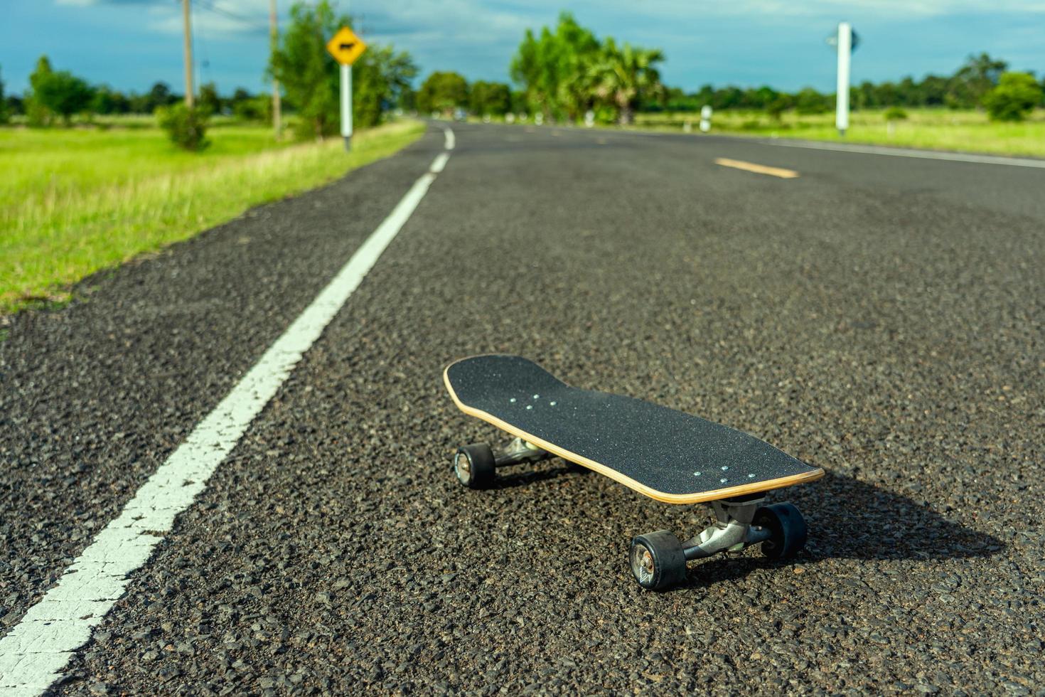 Surf skate on road in the countryside. photo