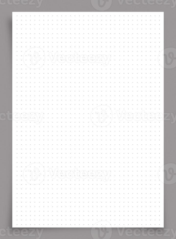 White paper with dot pattern on gray background. photo