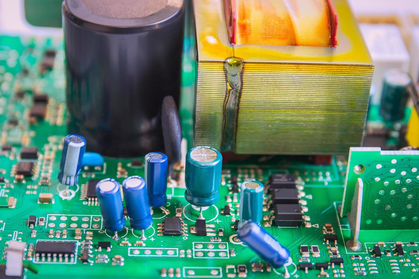 Electronic circuit board of computer with electronic parts close up. photo