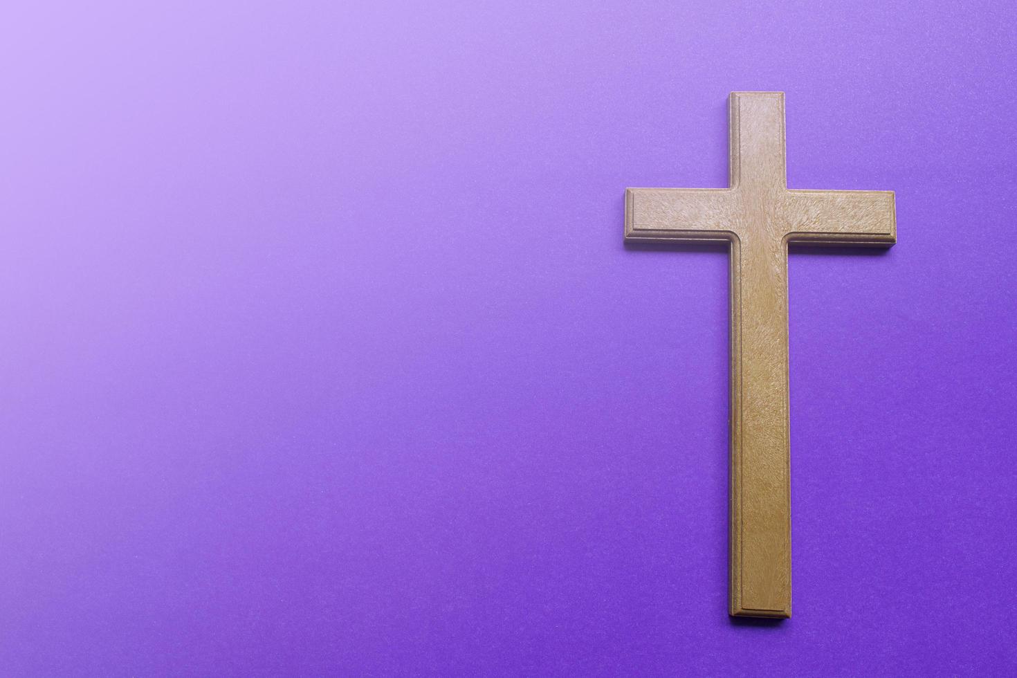 Palm leaves on purple background. Holy week and Lent season concept. photo
