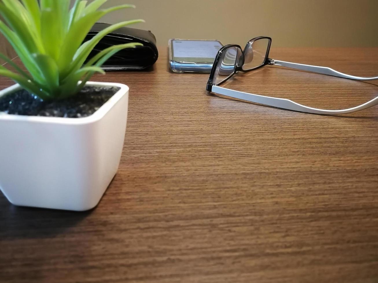 Blurred background of old wallet on the wooden desk photo