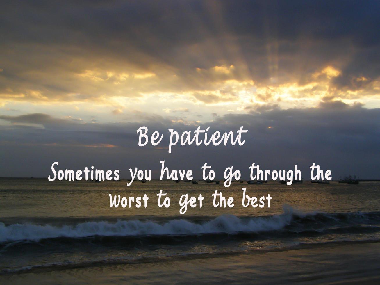 Motivational and inspirational quote on sunset beach. Be patient concept. photo
