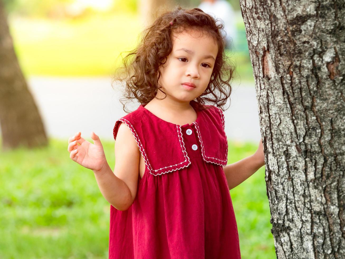 Young children play and learn outside of school to enjoy themselves in the nature park photo