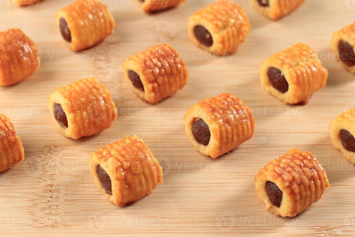 Nastar Gulung or Roll Pineapple Cookies or Pineapples Tarts. Rolls FIlled with Pineapple Jam, Kue Kering for Hari Raya Lebaran photo