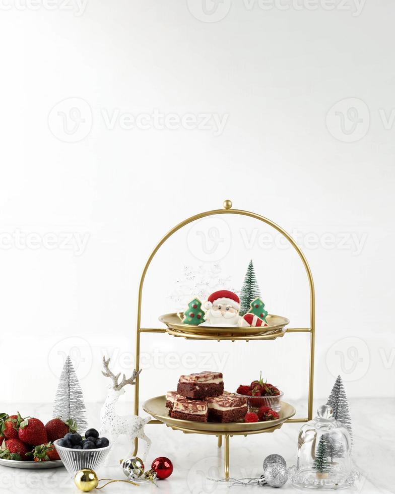 Christmas High Tea Cake and Cookies Concept, White Christmas Sweet Table Setting, Copy Space for Text photo