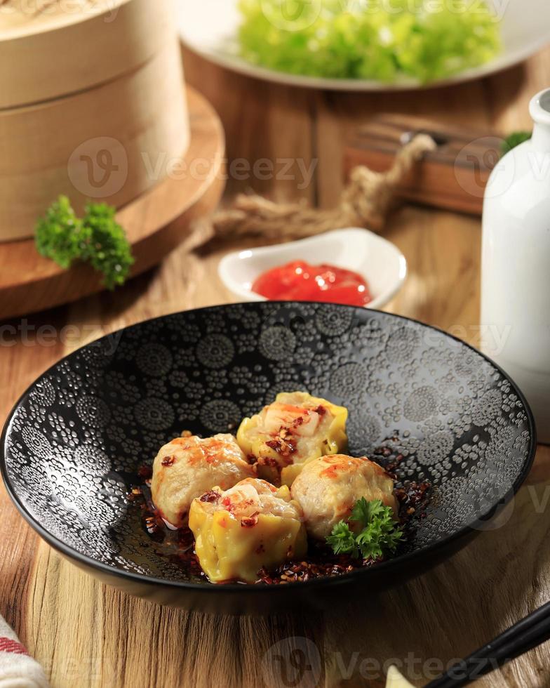 Asian pdumpling gyozas with red chilli oil, photo