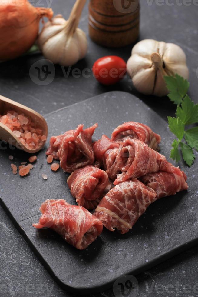 Fresh Beef Raw Meat Slice on Stone Plate for Sukiyaki, Shabu, Yakiniku, or Korean Barbeque BBQ photo