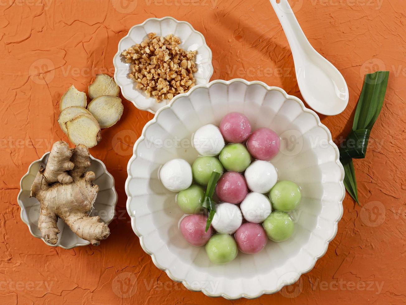 Top View Colorful Chinese Food Hot Soup Dessert, Glutinous Rice Ball Soup Tangyuan Orange Table. photo