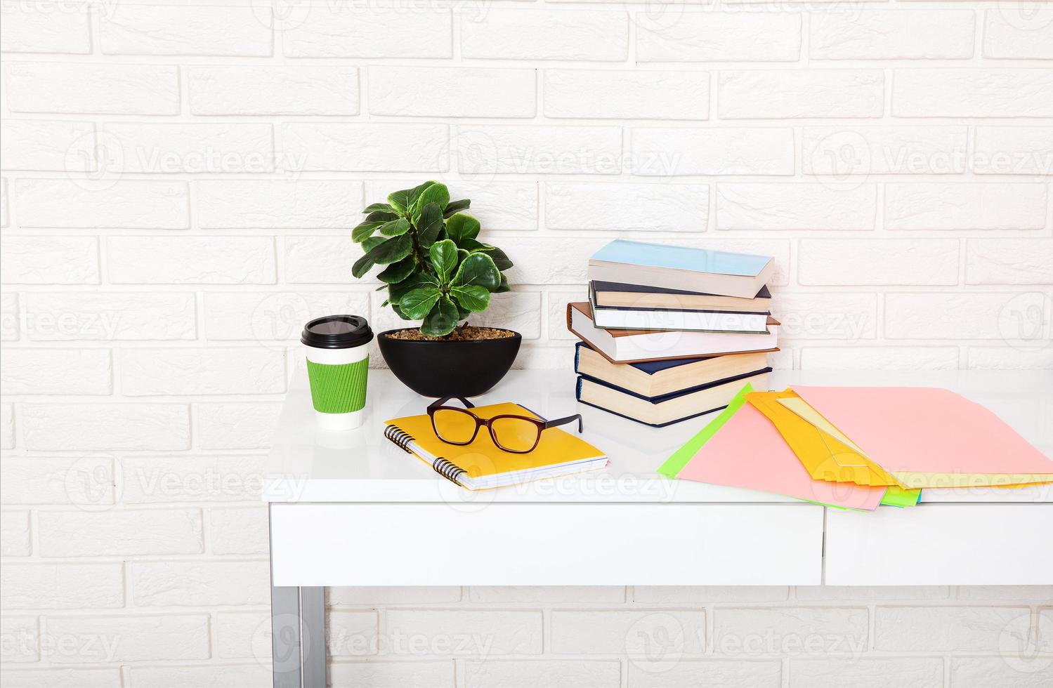 Workplace and education accessories on white table. Selective focus and copy space. Business school concept photo