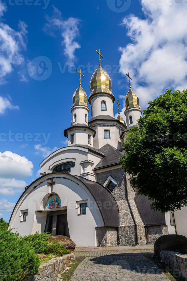 Christian church cross in high steeple tower for prayer photo