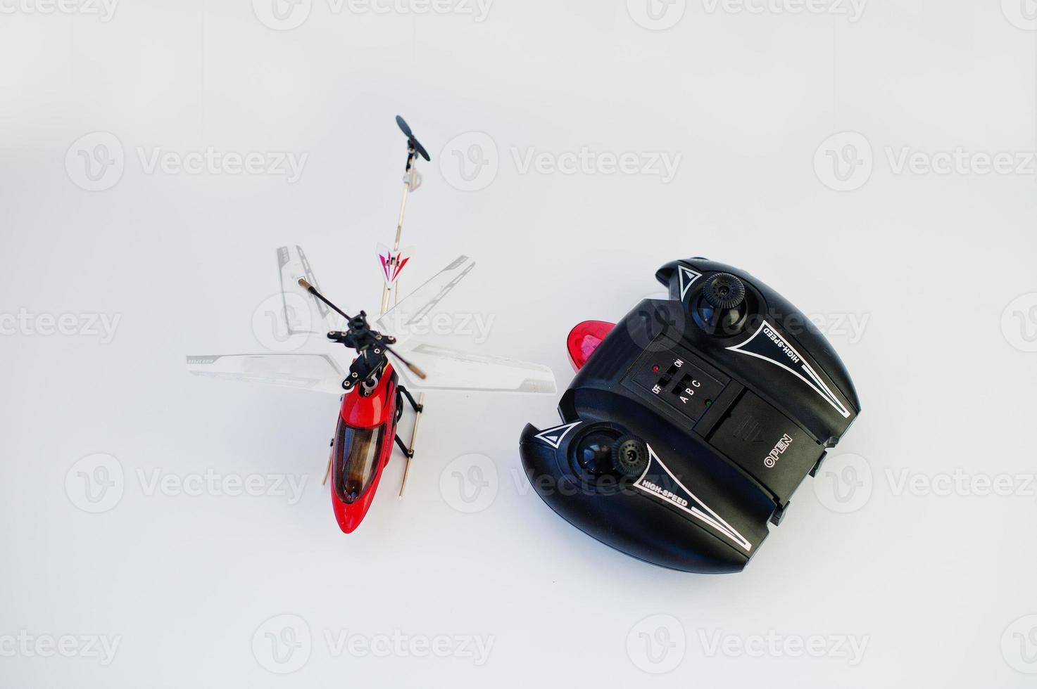 Remote control red helicopter isolated on white background. photo