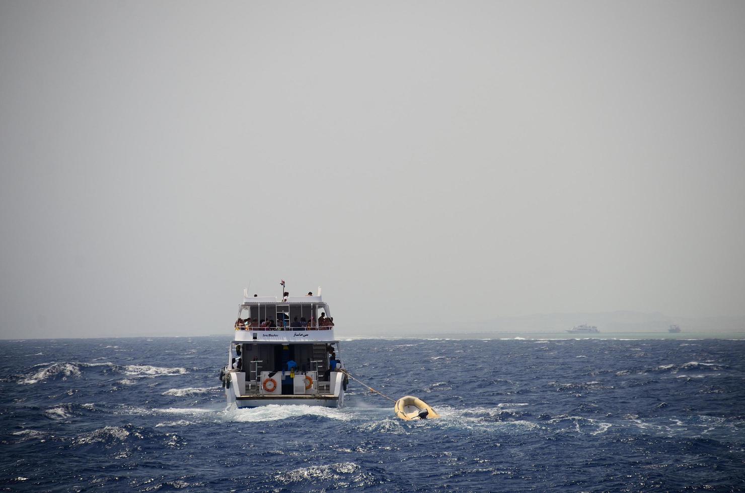 ship in sea with waves photo